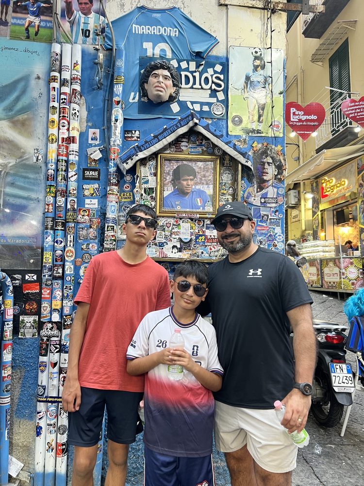 Sonny and his sons at the Maradona shrine in Naples